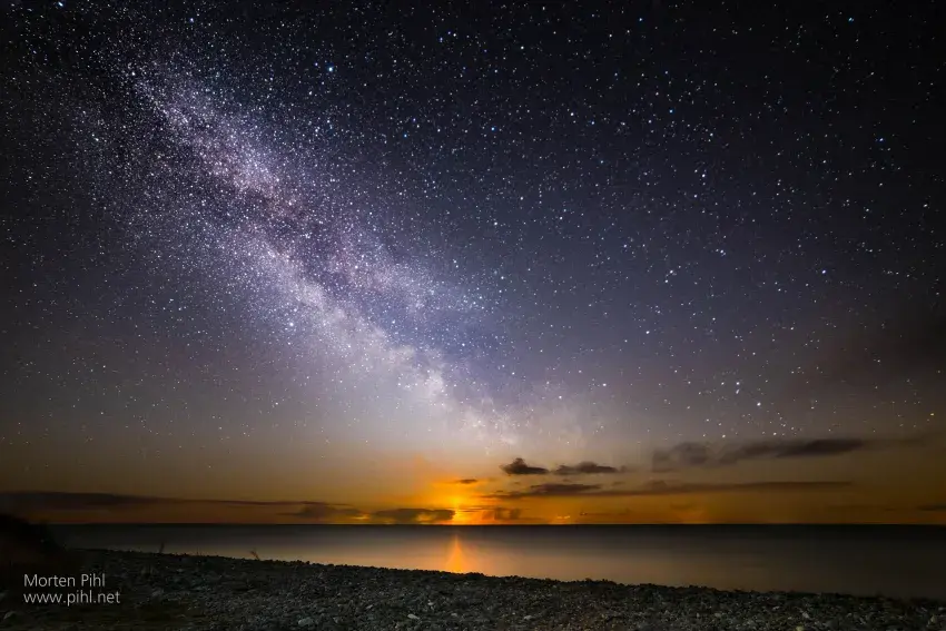 Moon rising under Milky Way