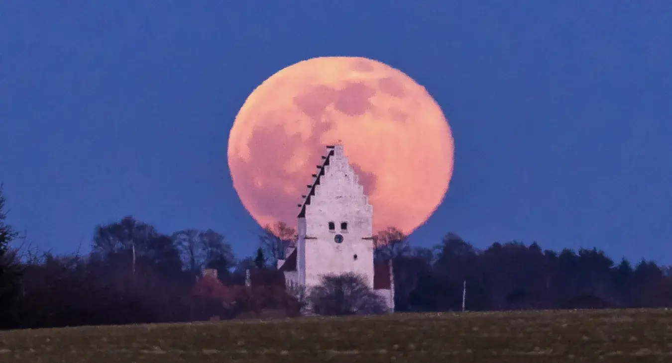 Full Moon rising behind Elmelunde Church